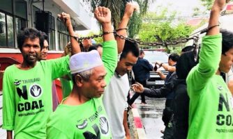 Thai authorities block march, charged participants